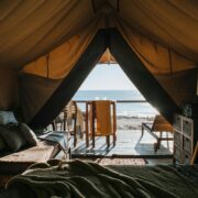 Cozy tent with a terrace next to the beach