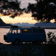 Volkswagen camper next to a lake